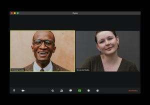A middle aged black man and white woman side-by-side on a video call